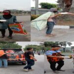 Membagikan Nasi Kotak Kepada Buruh Pekerja. (Foto : Garda45.com)