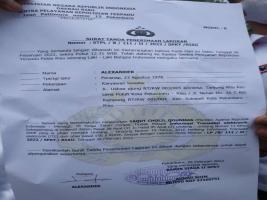 Teks foto : Surat tanda terima laporan